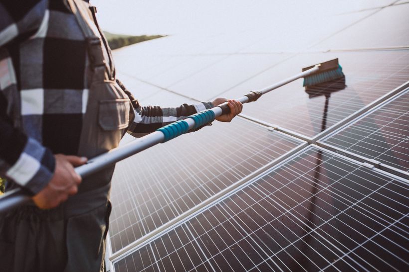 Technician maintaining a solar panel system