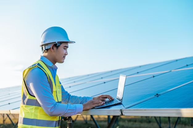 Solar technician inspecting panel performance